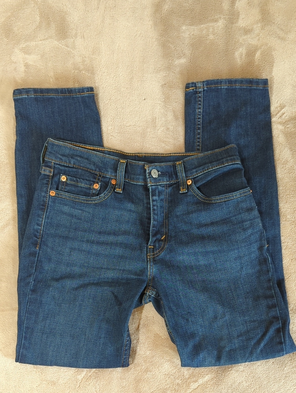 Levi's 511 slim-fit medium-wash denim jeans featuring a classic leather patch